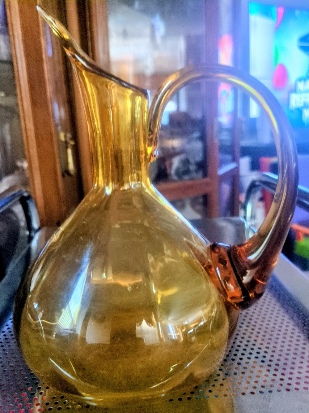 Vintage hand-blown amber glass ribbed pitcher, likely by Rainbow Glass.